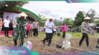 Walikota Weny dan Kapolres Kotamobagu saat penanaman jagu program ketahanan pangan